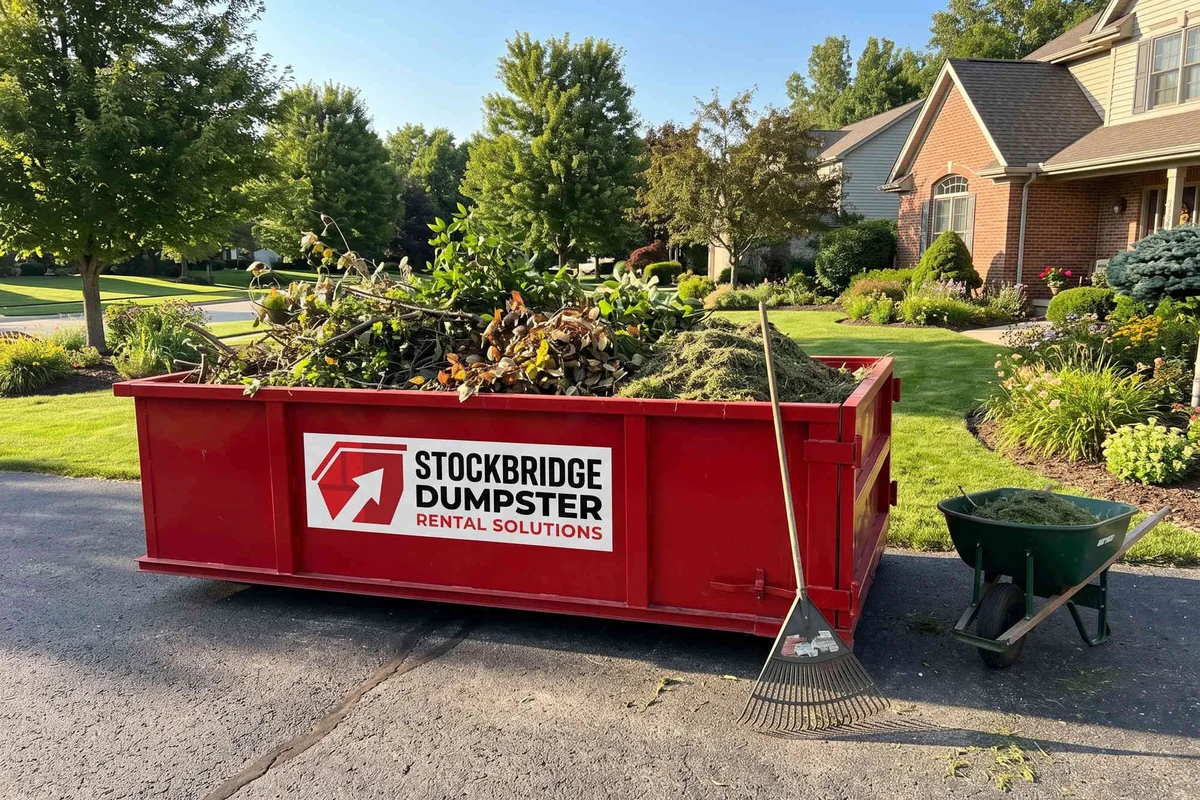 Residential roll-off dumpster placed neatly on a Stockbridge home driveway